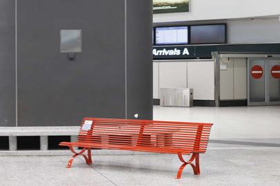 Two red benches at Milan Malpensa airport